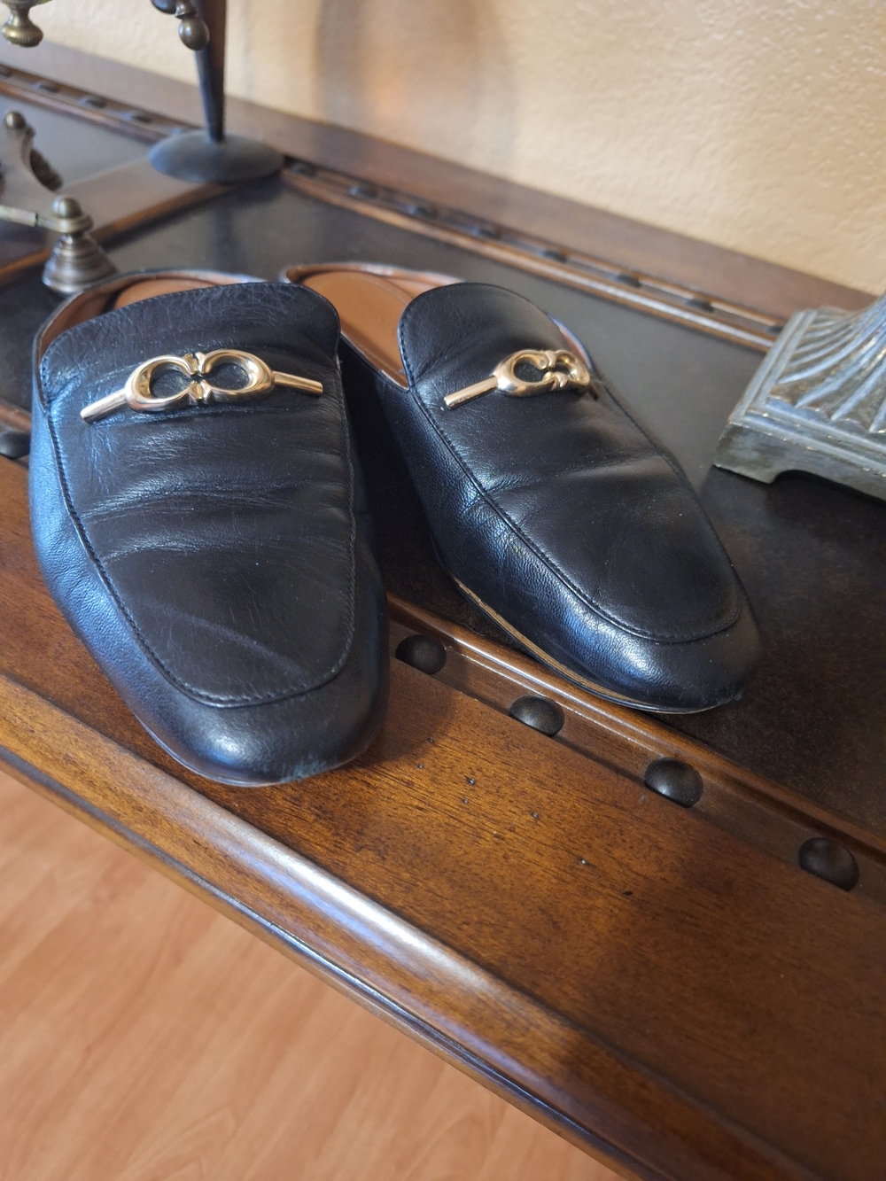 Classic Black Leather Women’s Slip-On Coach Loafers with Gold Accent